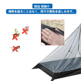 a person is putting a mosquito in a tent