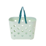 a white basket with hearts on it