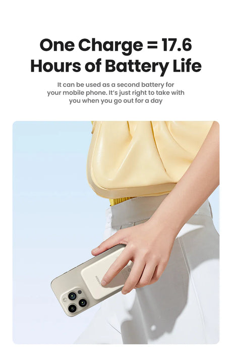 Portable battery charger or power bank being held next to a smartphone.