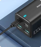 Portable battery pack or power bank with multiple USB ports and a USB-C input.