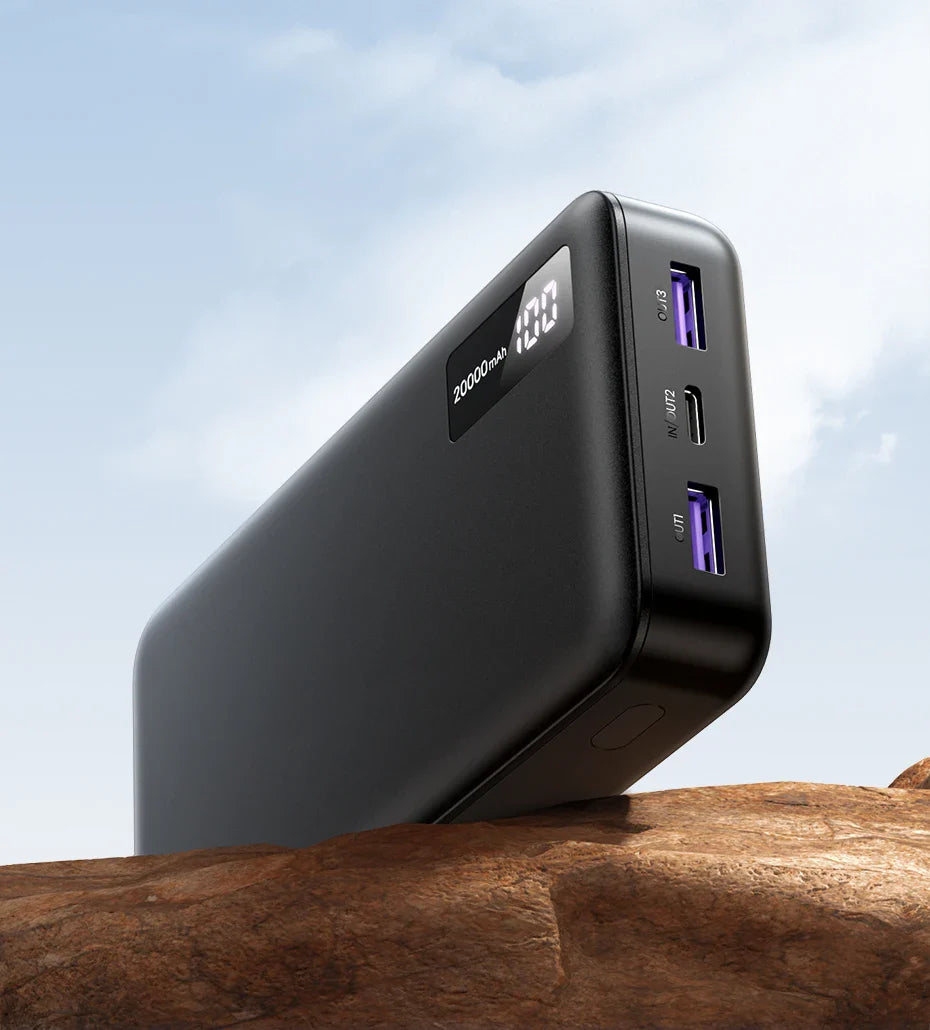 Portable battery pack or power bank with USB ports and a digital display.