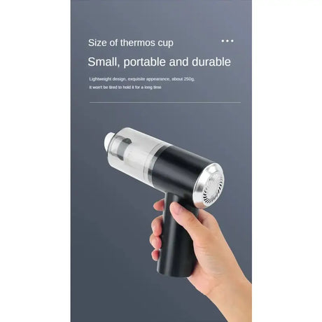 a hand holding a black and silver portable shower spray