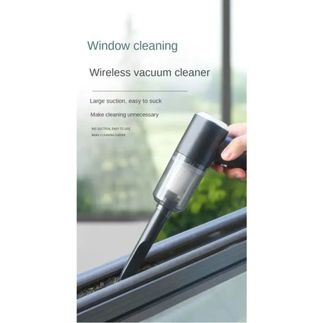 a hand holding a window cleaning device