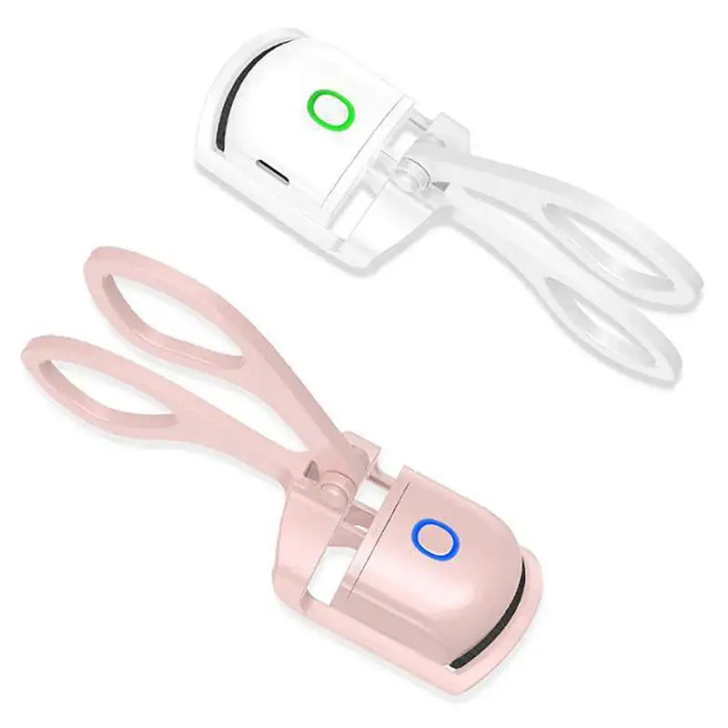 a pair of pink and white scissors with a green button