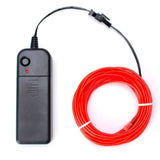 a close up of a remote control and a red wire