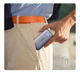 Portable power bank being removed from a pants pocket.