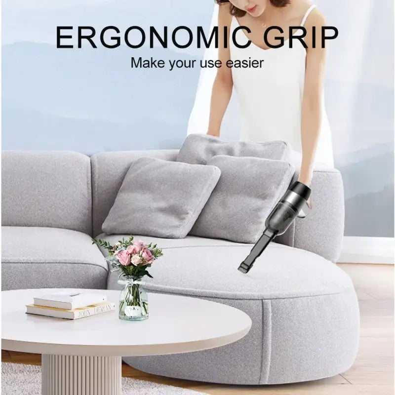 a woman is using a vacuum cleaner on a couch