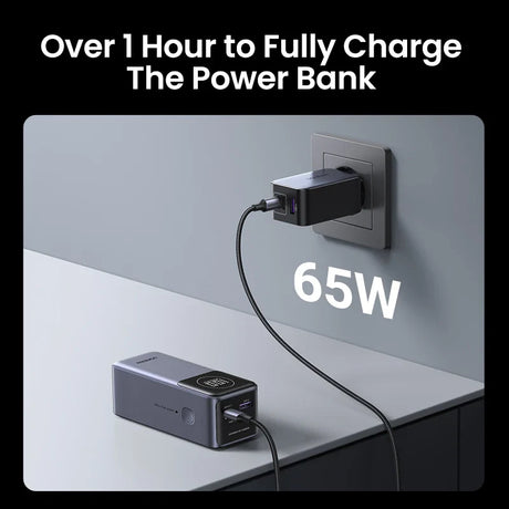 Power bank with a digital display connected to a wall charger.