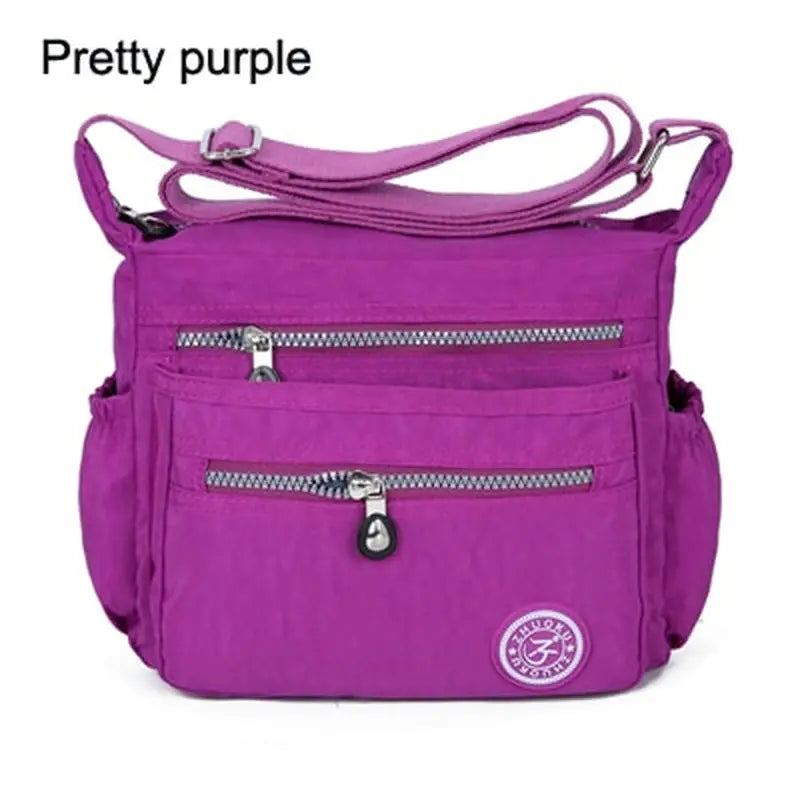 a purple purse with a zipper on the front