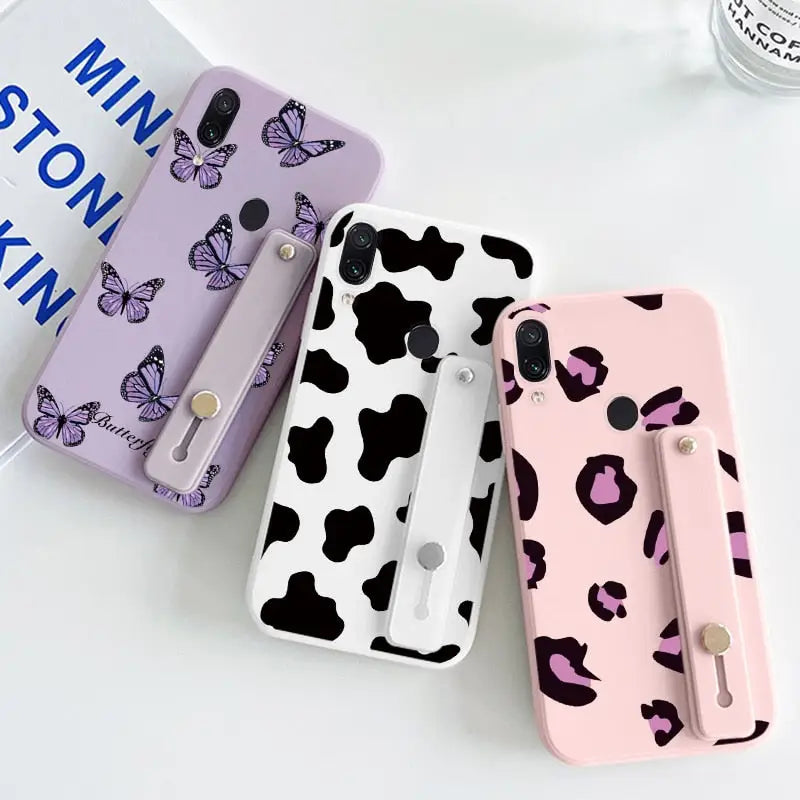 three different color cow pattern phone cases