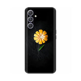 a black phone case with a yellow flower on it