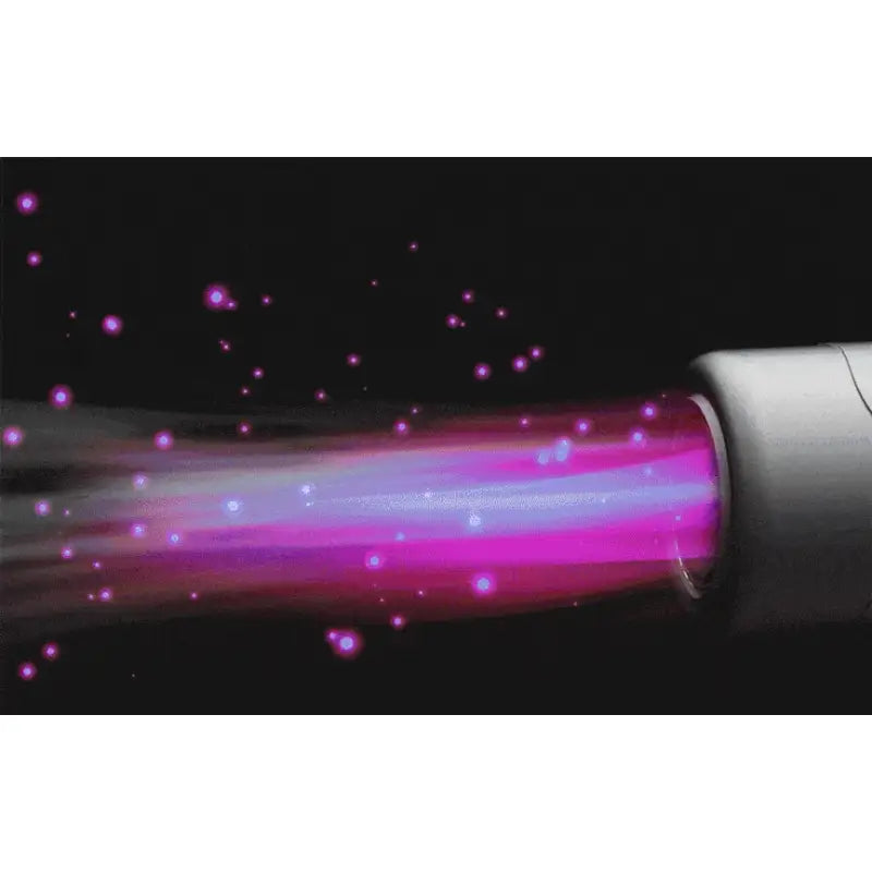 a pink laser light emis from a black background