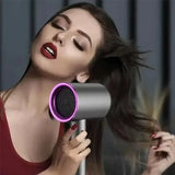 a woman with long hair is holding a hair dryer