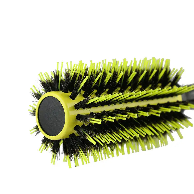 a green and black brush with a black handle