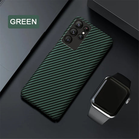 A protective phone case with a green carbon fiber pattern.