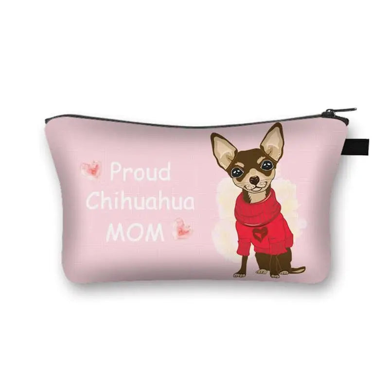 a pink bag with a chihuahua dog wearing a red sweater