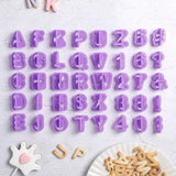 a purple alphabet cookie cutter with letters and numbers