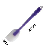 a purple brush with a white handle