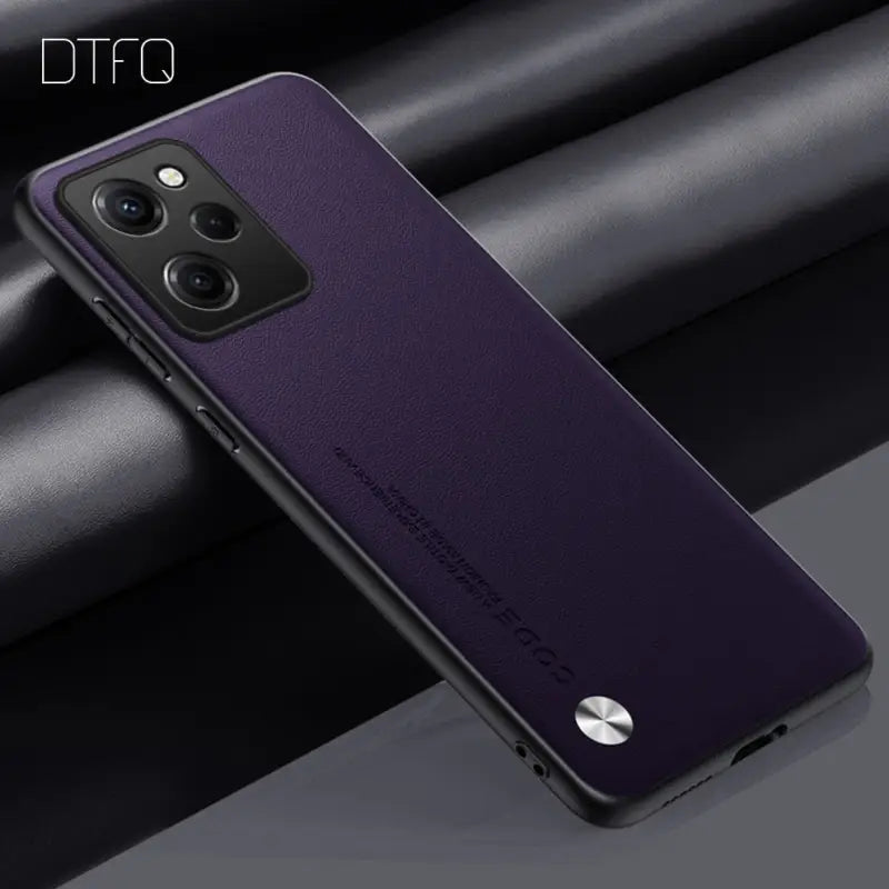 the back of a purple case with a black background