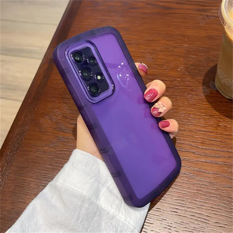 a woman holding a purple samsung phone case