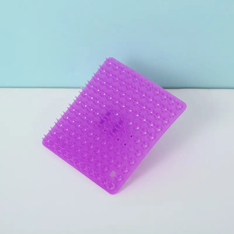 a purple plastic comb with a white background