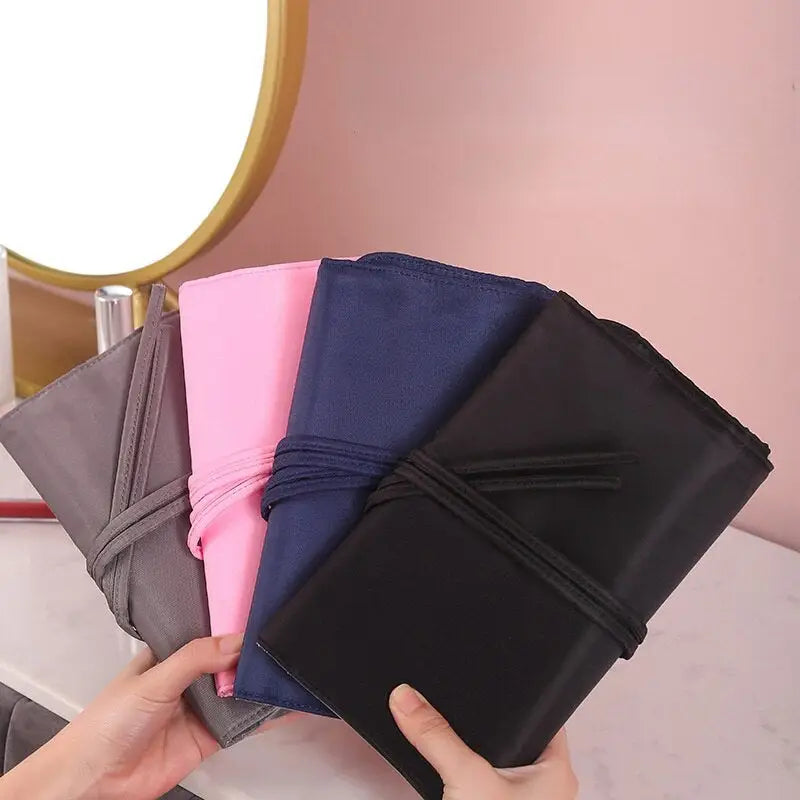 a woman holding a wallet with four different colors