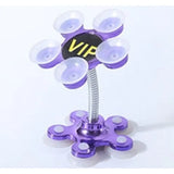 a purple flower shaped object with a black and yellow sign