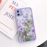 a purple phone case with flowers on it