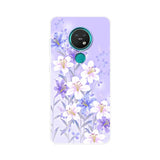 the back of a purple and white floral phone case