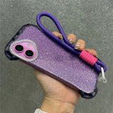 Purple glitter phone case with a purple lanyard and pink silicone ring.