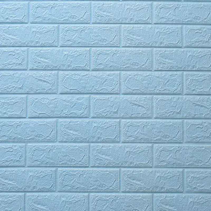 a blue brick wall with a white painted brick