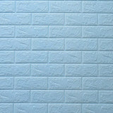 a blue brick wall with a white painted brick