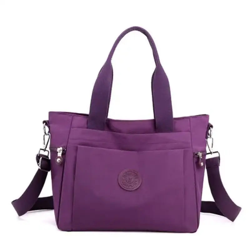 a purple handbag with a zipper closure