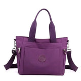 a purple handbag with a zipper closure