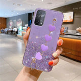 a woman holding a purple phone case with hearts