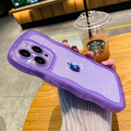 A purple iphone case with a purple iphone in the background