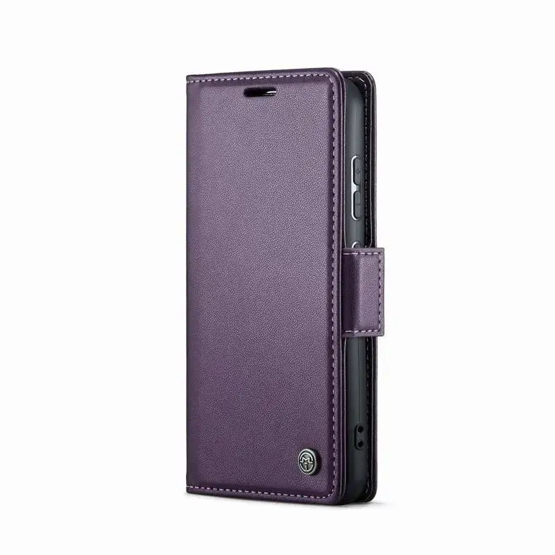 The back of a purple iphone case with a black leather cover