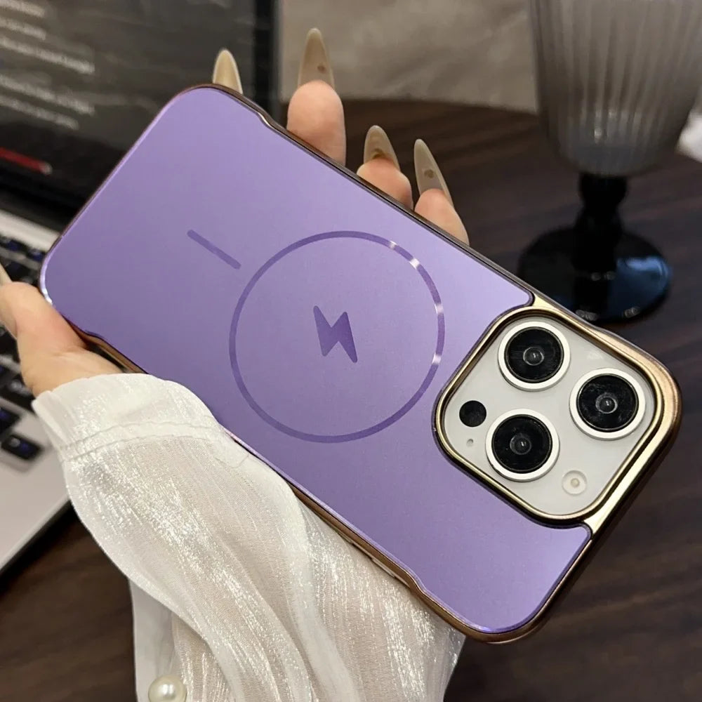Purple iPhone case with a gold trim, MagSafe charging symbol, and a triple camera cutout.