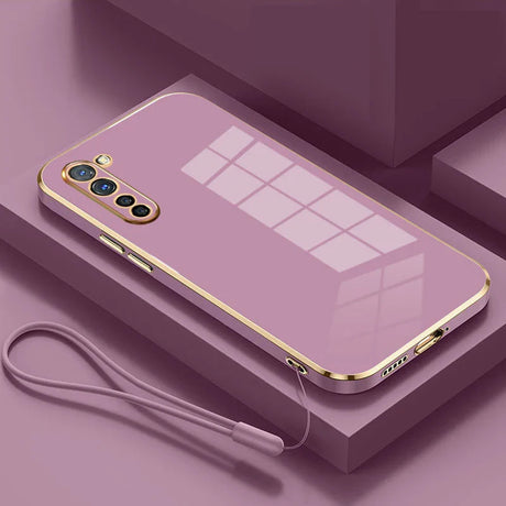 a purple iphone case with a gold frame and a white cable