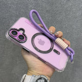 Purple iPhone with a clear case, camera lens protectors, and a purple wrist strap.