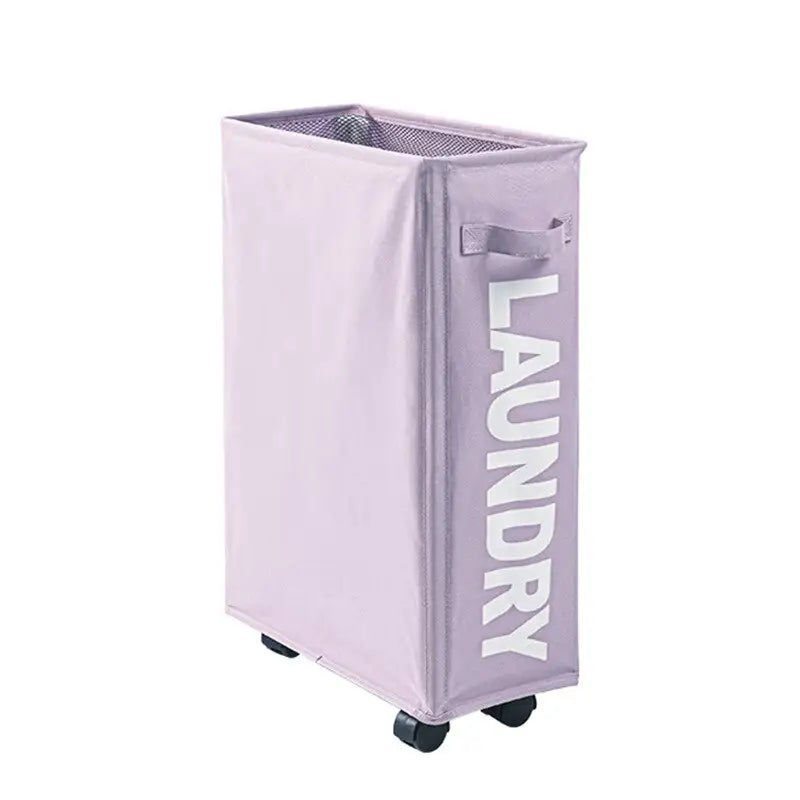 the laundry bin is a purple plastic bin with a white lettering that reads laundry