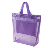 a purple mesh bag with a handle