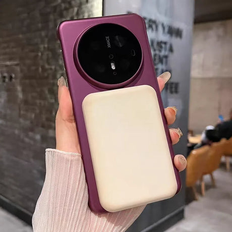 Purple phone case with circular camera module and rectangular attachment.