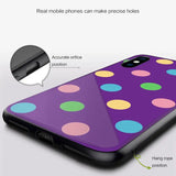 a purple phone case with colorful polka dots