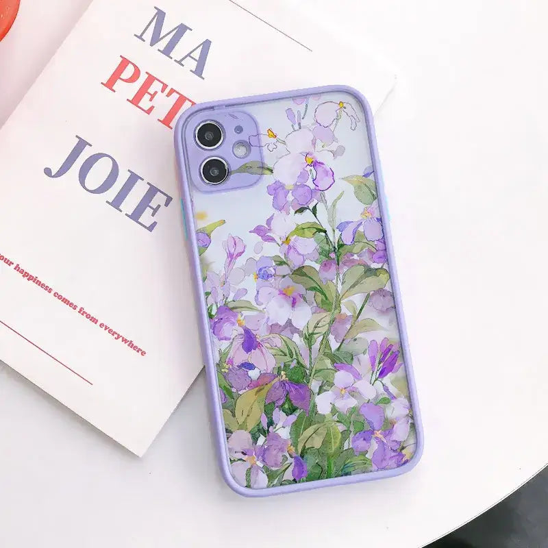 a purple phone case with flowers on it