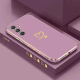 a purple phone case with gold hearts on it