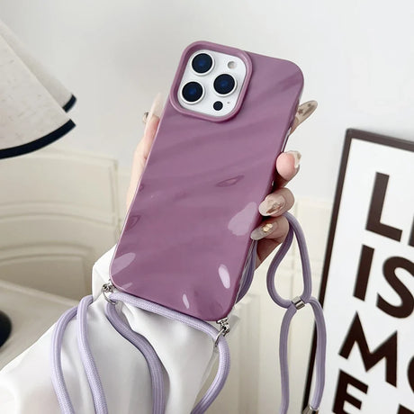 Purple phone case with lanyard.