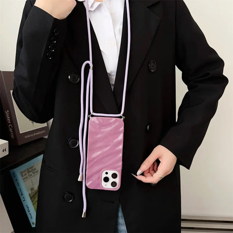 Purple phone case with lanyard.