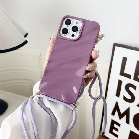Purple phone case with lanyard.