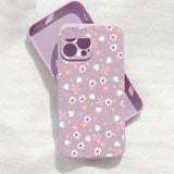 a purple phone case with a pink flower pattern